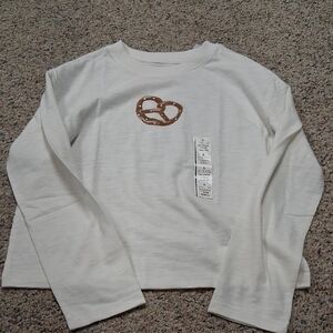 Cat & Jack Cream Long Sleeve Shirt with Pretzel Graphic